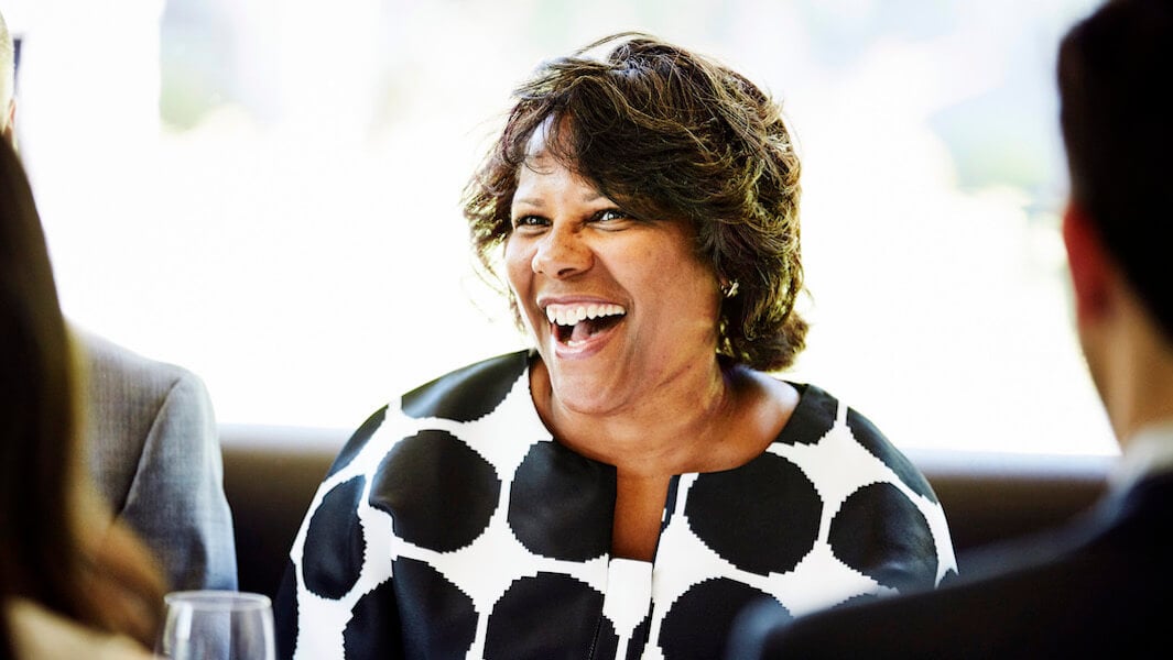 Woman in a business meeting with a bright, genuine smile