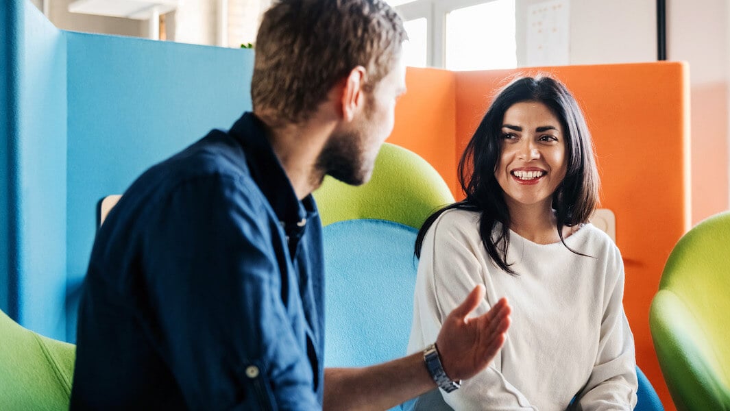 Man and woman working together in an office environment