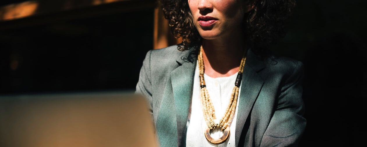 Woman focused on work at laptop