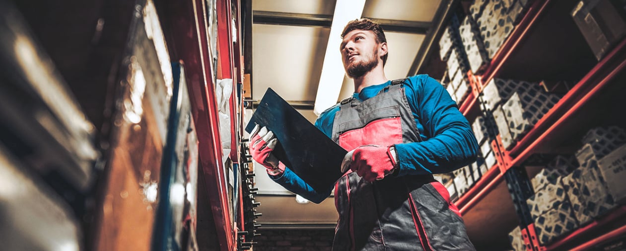 Employee pulling auto parts from shelves