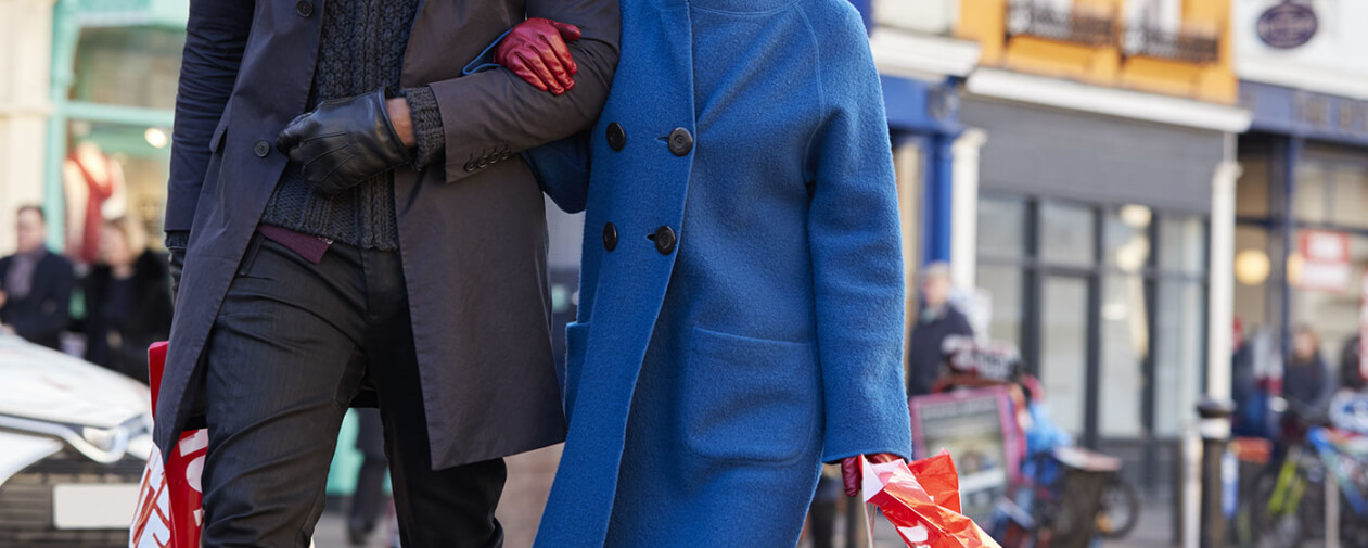 Couple walking with holiday shopping bags