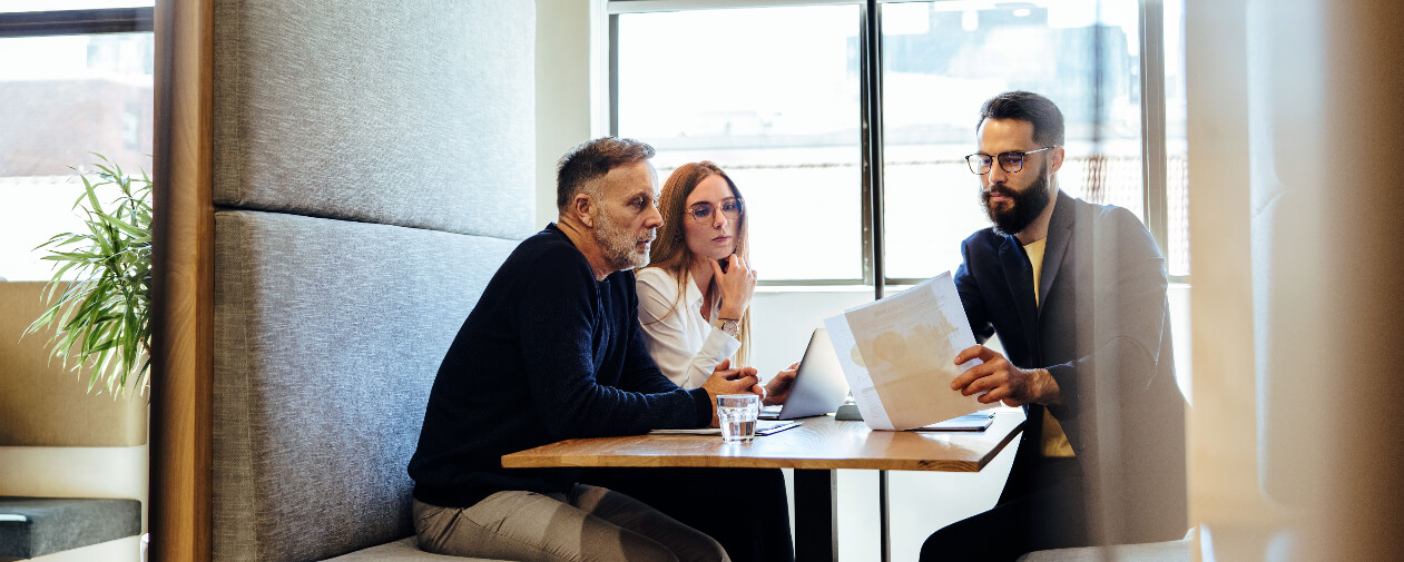 Three sales leaders discussing revenue strategy