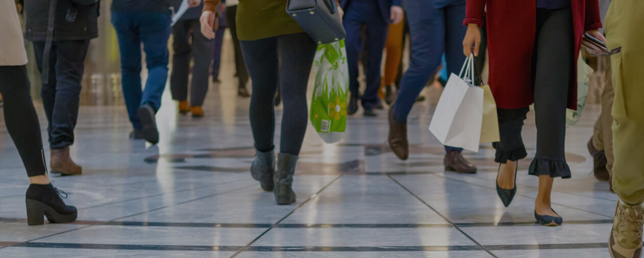 Photo of shoppers walking from legs down to floor