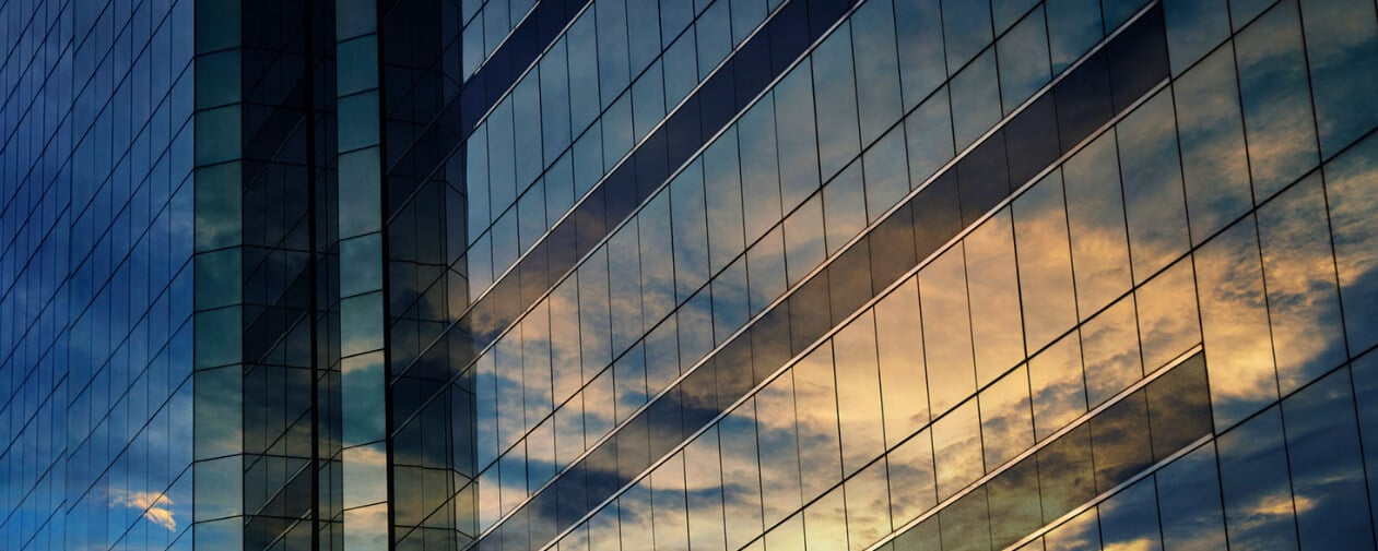 A picture containing cloud, sky, building, reflection