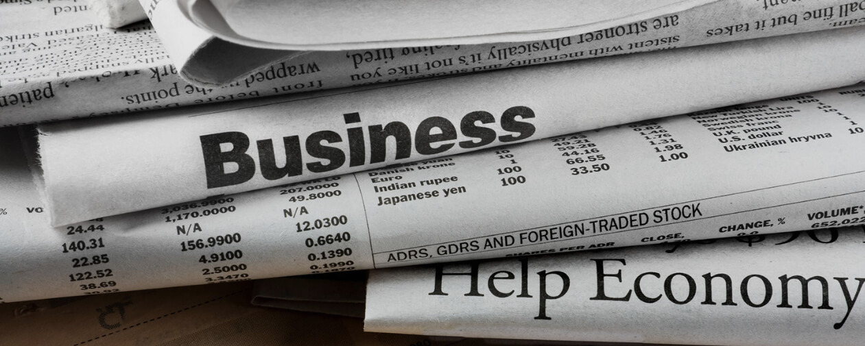 A picture containing business and financial newspapers