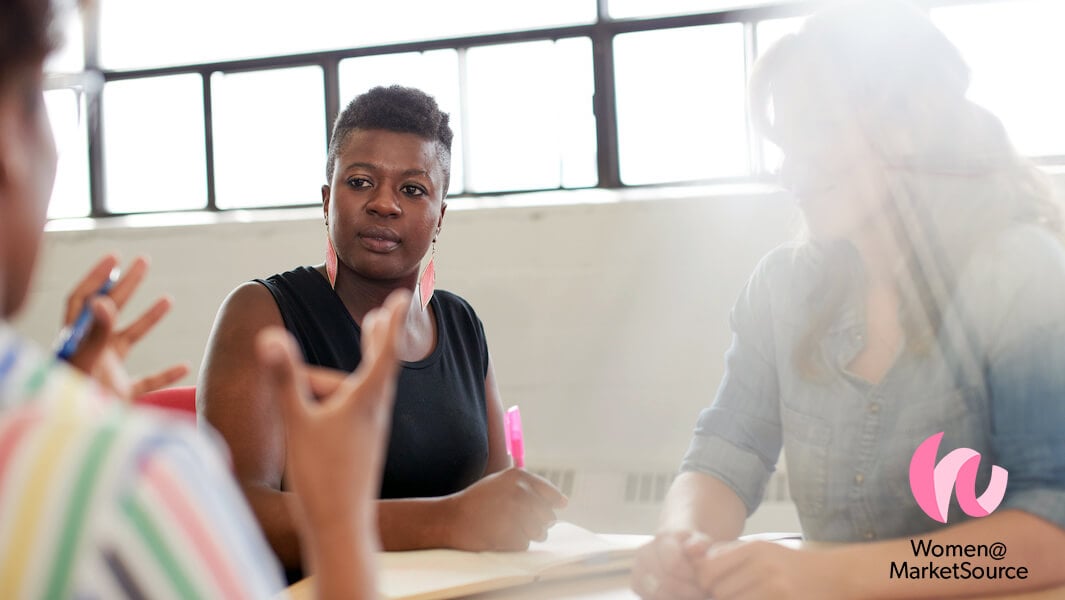 Woman in a business meeting with a bright, genuine smile