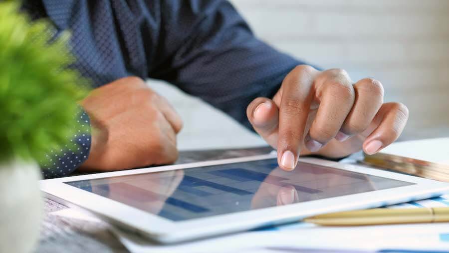 Sales Channel Profiling Someone reviewing information on their tablet