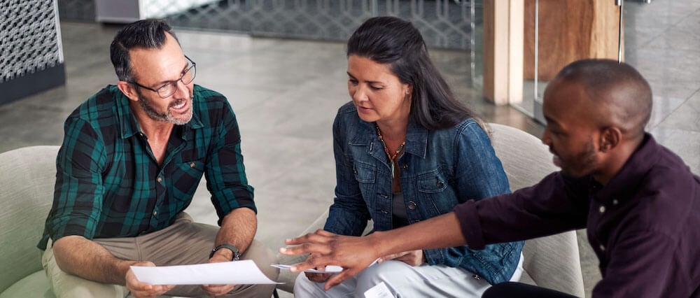 Casual meeting of diverse business team discussing best practices